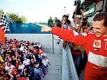 **Title:** Michael Schumacher Celebrates Victory with Ferrari on Podium