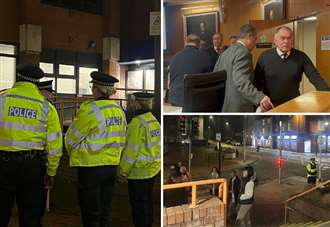 **Headline:** Council Meeting on Immigration Disrupted Amid Police Presence