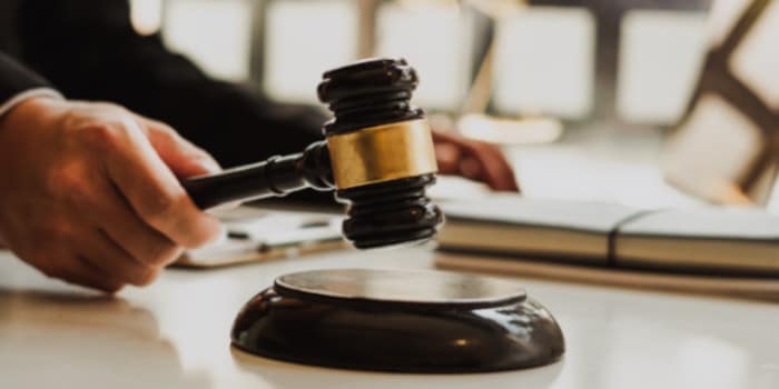 **Headline:** Ten People on Trial After Acid Attack Linked to Debt Owed to Alleged Drug Lord