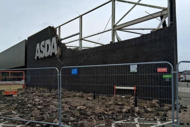 **Headline:** Part of Asda Exterior Wall Collapses onto Disabled Parking Area
