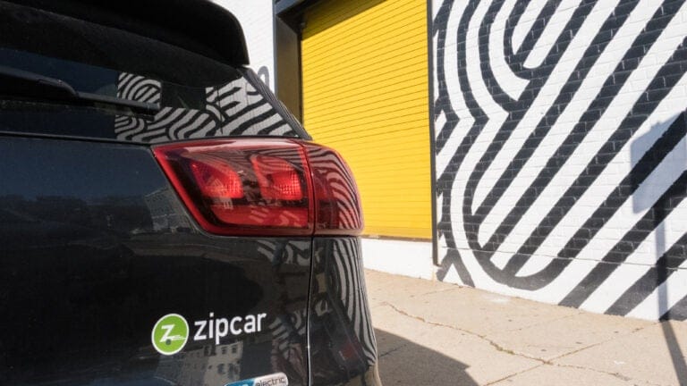 **Headline:** Zipcar to Close Boston Headquarters, Eliminate Over 100 Positions