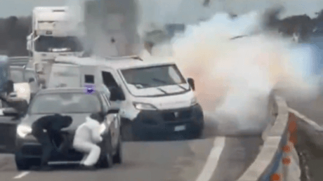 **Headline:** Masked Assailants Attack Armored Van in Daytime Heist on Italian Motorway