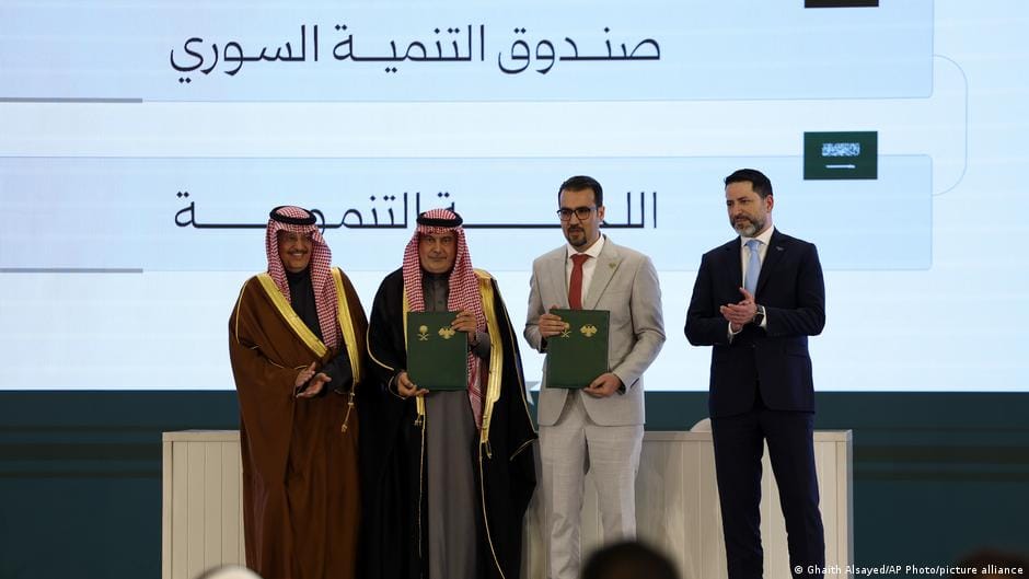 **Headline:** Syria and Saudi Arabia Agree on Investment Deals in Telecommunications and Aviation